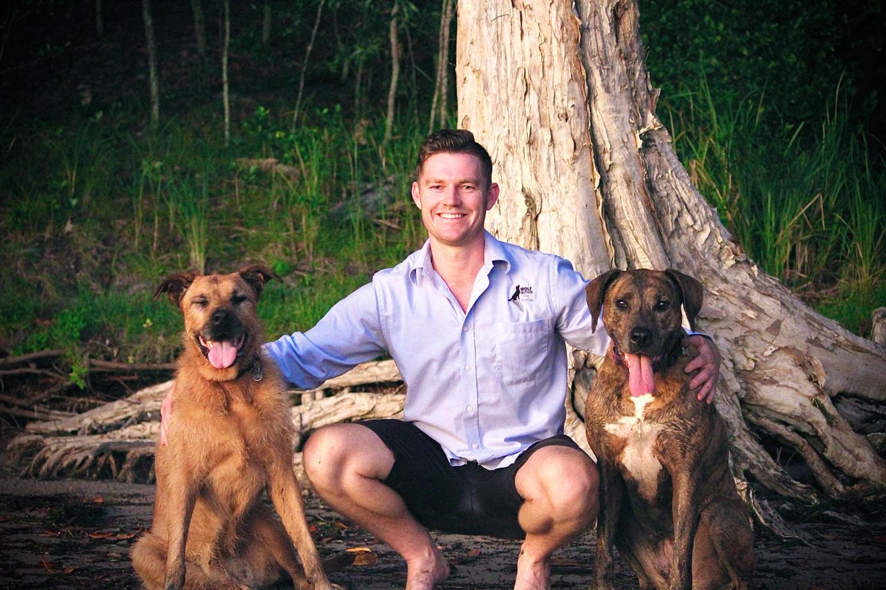man with two dogs