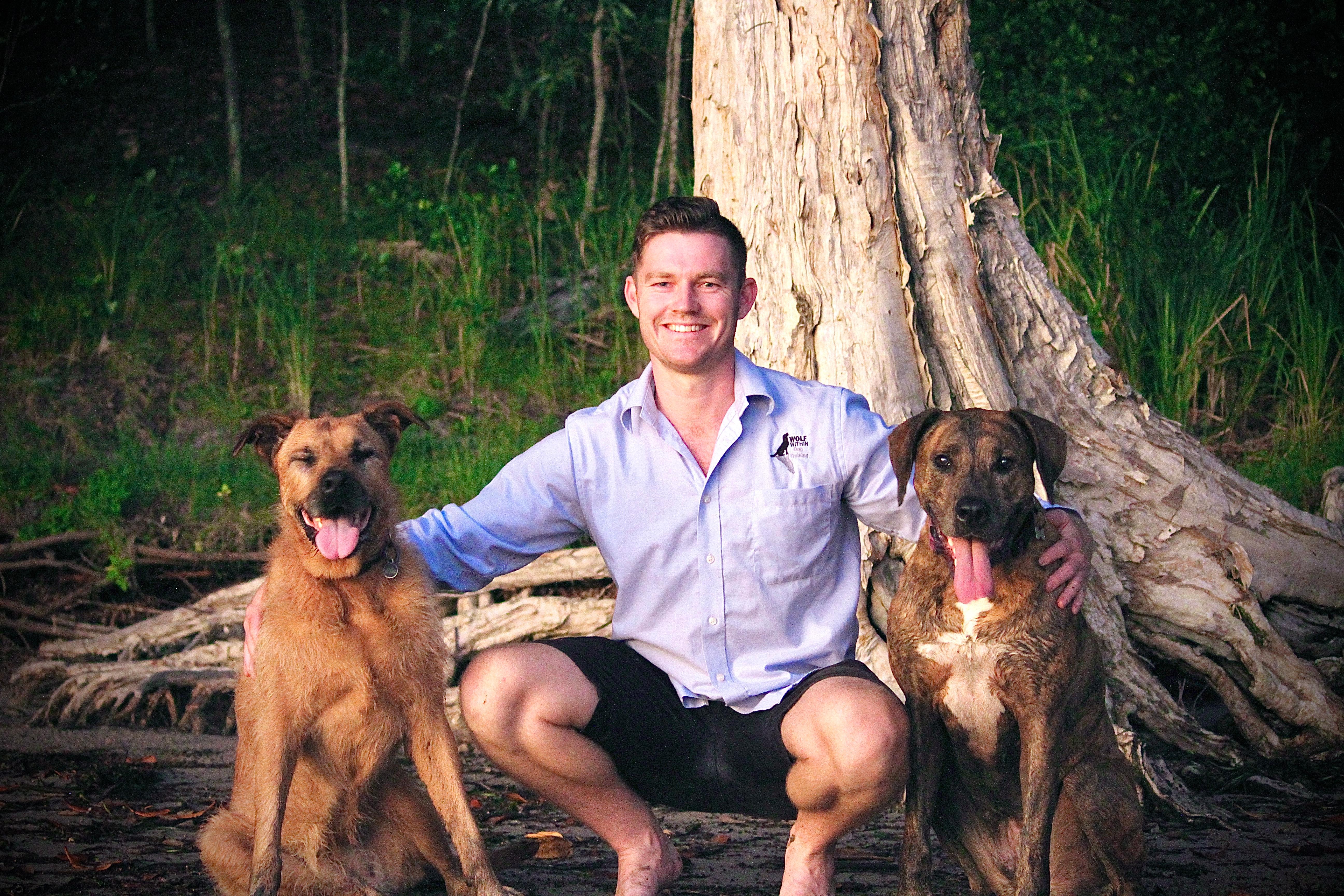 man with two dogs